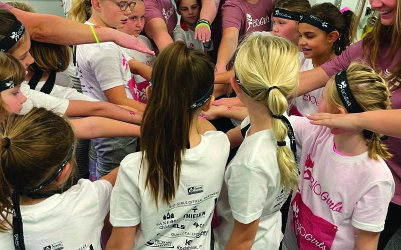 Before and after each session, and the 5K, the BIO Girls placed their hands together, then lifted them up to their air shouting, “In and out, I count!”