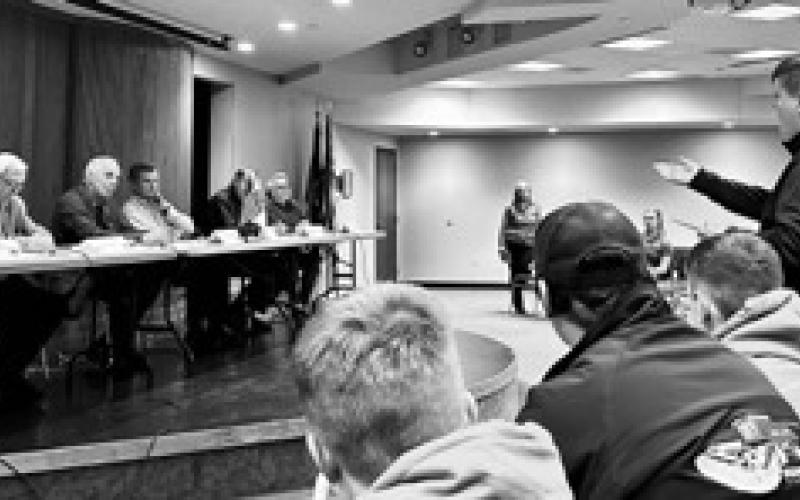Bridger Rivinius, 4-H member from Stutsman County, stands to ask a question of North Dakota legislators during a panel discussion. (NDSU photo)