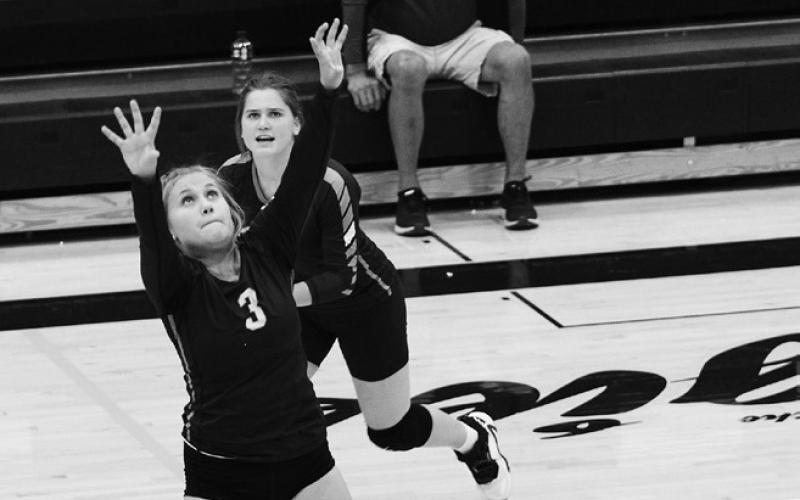 Junior Claire Thompson sets the ball vs. Park River. Thompson finished with 3 assists in the 3-0 loss to the Aggies.