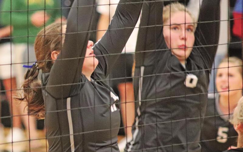 Maddison Hermanson (left) and Kiera Aassand (right) block the ball from the Hatton Northwood Thunder in Drayton. VNV Photo by Lesa Van Camp