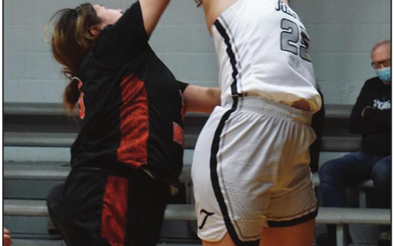 Ella Kittelson fights for a rebound against a Warrior defender. VNV Photo by Lyle Van Camp