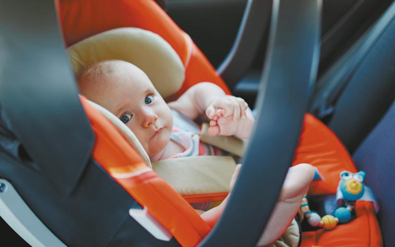In North Dakota, 70% of child car seats are not being used properly. Get yours checked at the numerous sites in the state offering car seat checkup clinics. Stock photo