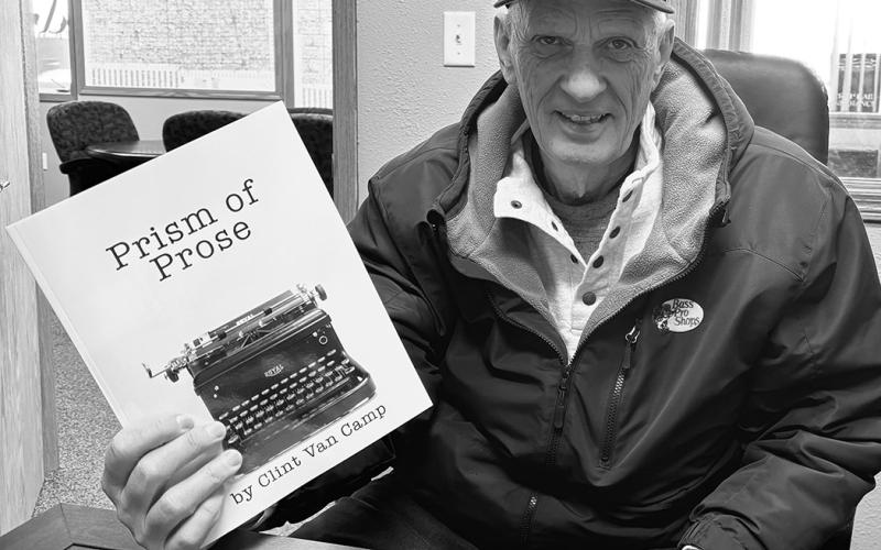 Clint Van Camp with his newly printed book, Prism of Prose. Photo by Andrea Johnston