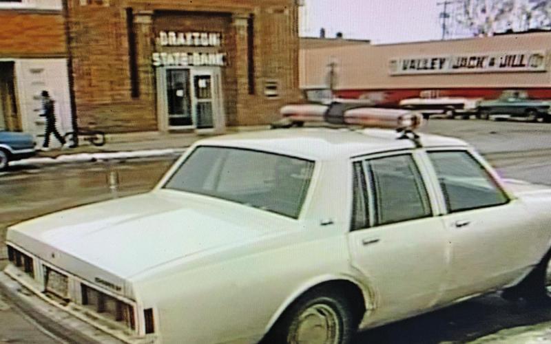 A police car is parked across from Drayton State Bank after it was robbed on Feb. 19. 1987. Contributed / State Historical Society of North Dakota