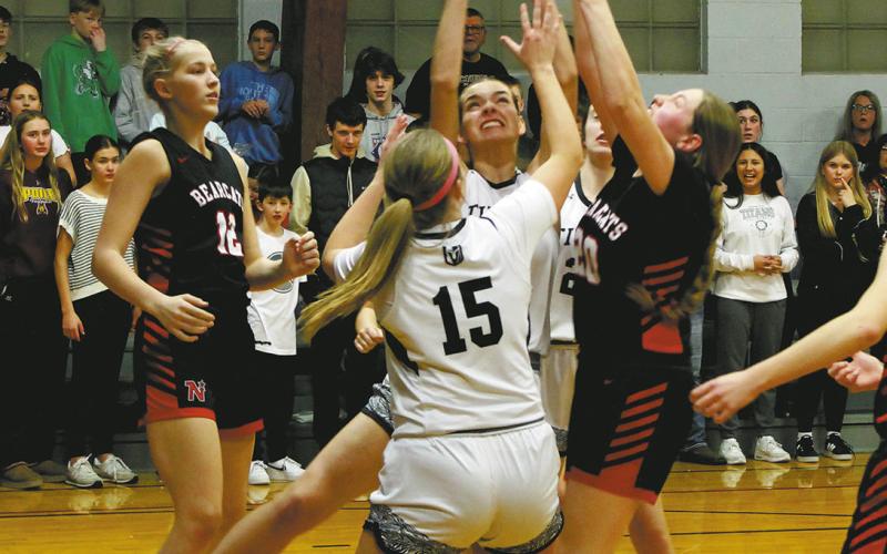 Titan Elizabeth Fedje battles to keep the ball following a rebound in Crystal on Feb. 7 against North Star. Photo by Jamie Rarick