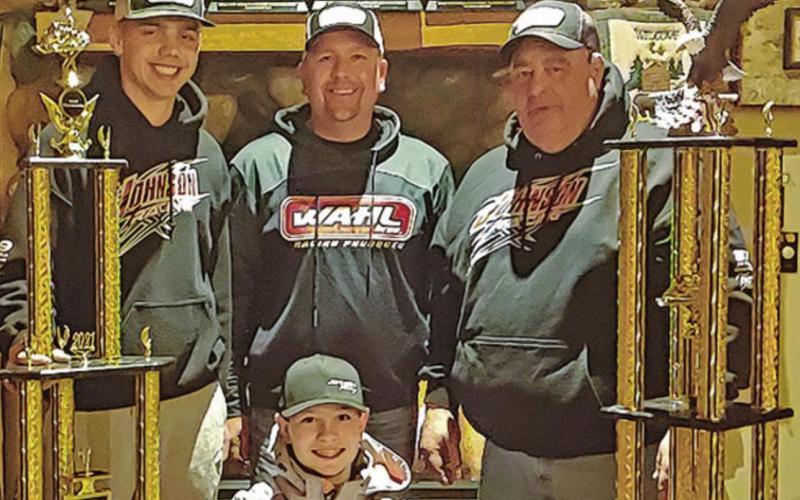 Hunter Johnson with his trophies. Pictured left to right: Jaden Haagenson, Scott Johnson, Hunter Johnson (front), and Gerry Beauchamp. Photo submitted by Johnson Racing