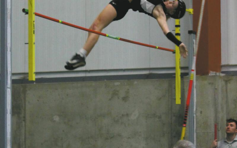 Clearing the bar, DVE junior Alyssa Hoyles finished 2nd for the day in Girls Pole Vault. Together with Minot North's McKinnley Kragh, a new meet record was set at 9' 9'. Photo by Jamie Rarick
