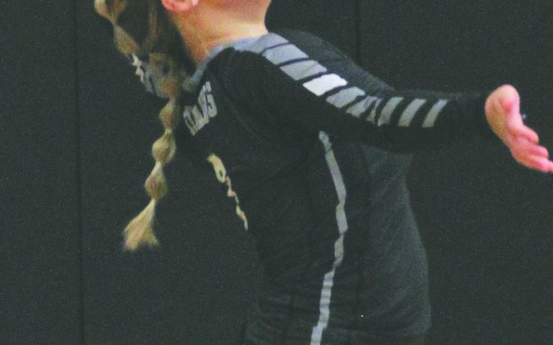 Junior Claire Thompson serves the ball vs. Grafton. Thompson had one service ace in the 3-0 loss to the Spoilers.