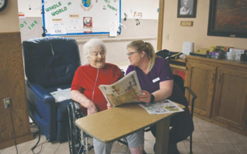 Heather Ahrendt (Nursing Dept. Scheduler and Med Tech) and Florence Mitzel (Resident). Photo by Levi Jones, News Monitor.