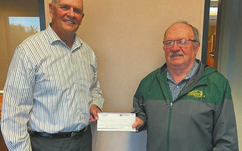 Pete Anderson, KodaBank left, with Andy Duncklee, Drayton Improvements, right. Submitted photo.