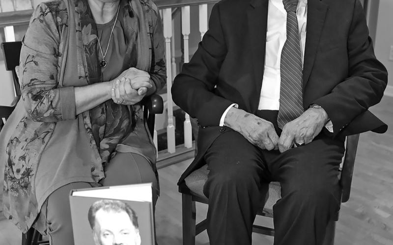 North Dakota’s longest serving Supreme Court Chief Justice Jerry VandeWalle poses with a copy of his biography, “Call Me Jerry” along with author Cecile Wehrman. Photo by Brad Nygaard, The Journal, Crosby.