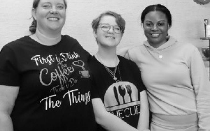 Sara Price, owner of The Cure, pictured with her daughter, Grace Follin, and her good friend Myeshia Lewis. Photo by Melanie Thornberg.