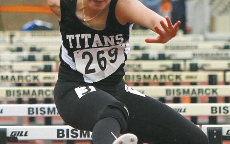 Jocelyn Vold competes in the 100-meter hurdle preliminaries at the Class B State Track Meet. Photo by Larry Stokke