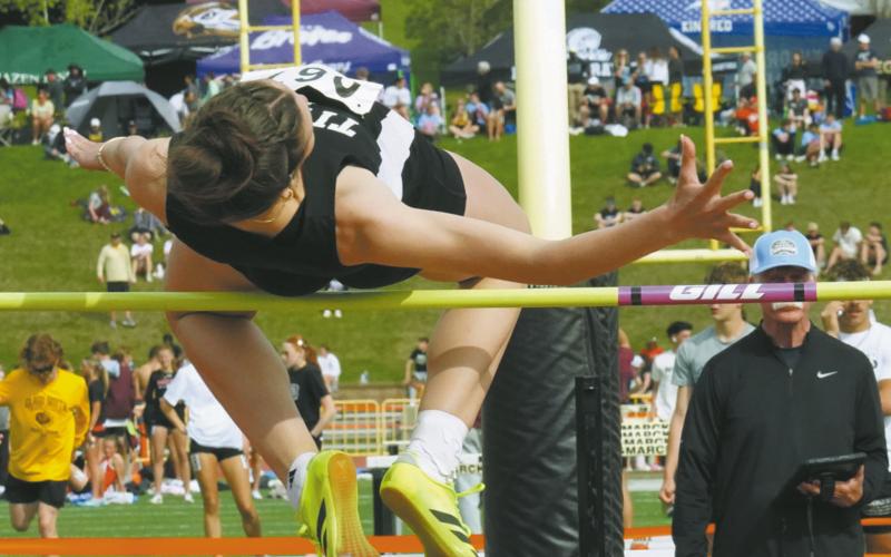 Senior Elizabeth Fedje defends her Class B State Champion title once again, placing first in the high jump at the Class B State Track Meet in Bismarck. Photo by Larry Stokke
