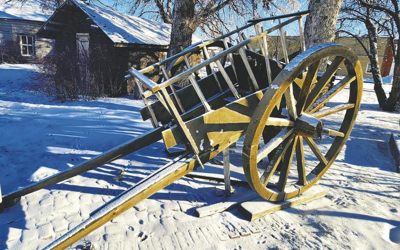 The ox cart sitting beside Blessing Museum. Photo by Hilary Nowatzki.