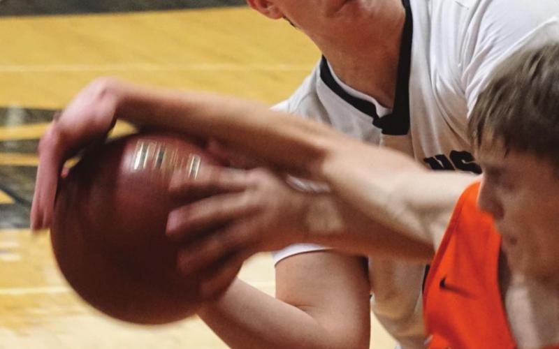 Gage Pollestad fights Larimore’s Avery Gratton for control of the ball. VNV Photo by Lyle Van Camp