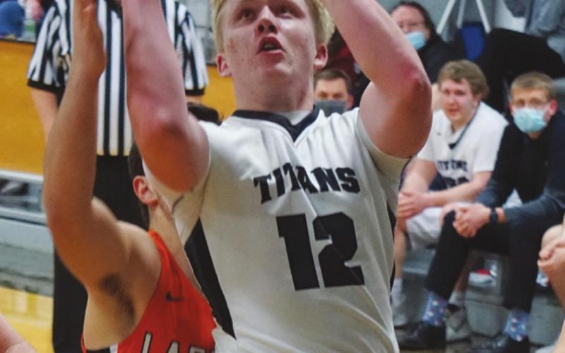 Caleb Kartes puts up a two point attempt in action against Larimore. VNV Photo by Lyle Van Camp