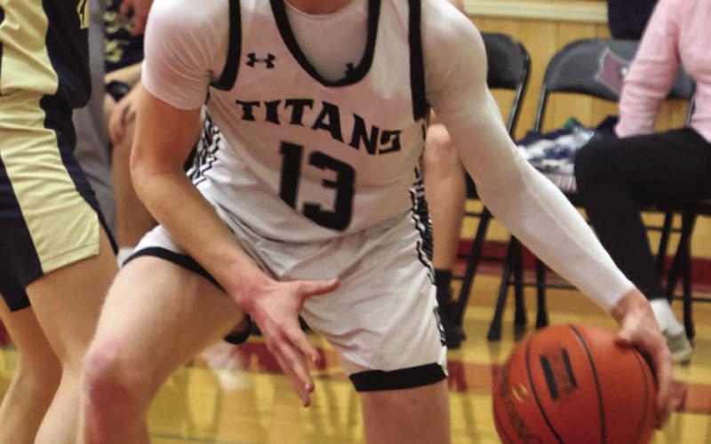 Connor Hurtt heads to the basket in action against North Border.