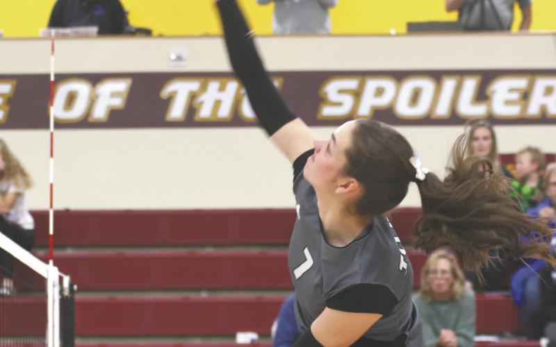 Elizabeth Fedje puts down a kill in regional tournament action Monday evening in Grafton. Photo by Lyle Van Camp