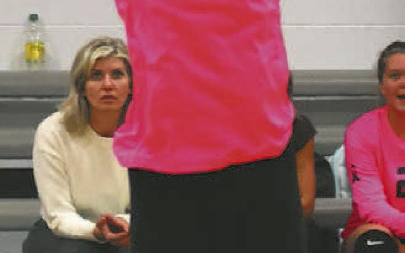 Claire Thompson puts up a set in action against Benson County.