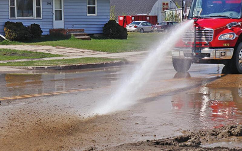The Drayton Volunteer Fire Department water truck was used to clean mud from the street following the repairs. VNV Photo by Lesa Van Camp