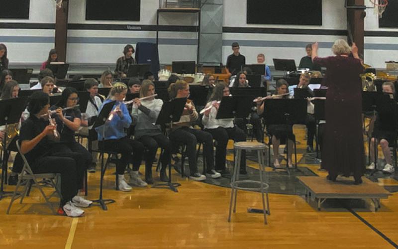 Last week, combined bands from Cavalier, Drayton, North Border, and Valley-Edinburg performed in the Pembina County Band Festival concert at the Valley-Edinburg High School gymnasium at 6:30. Music teachers took turns directing the musicians and in this photo Sue O’Neil of Drayton can be seen directing. Photo by Jeremy Ratliff.