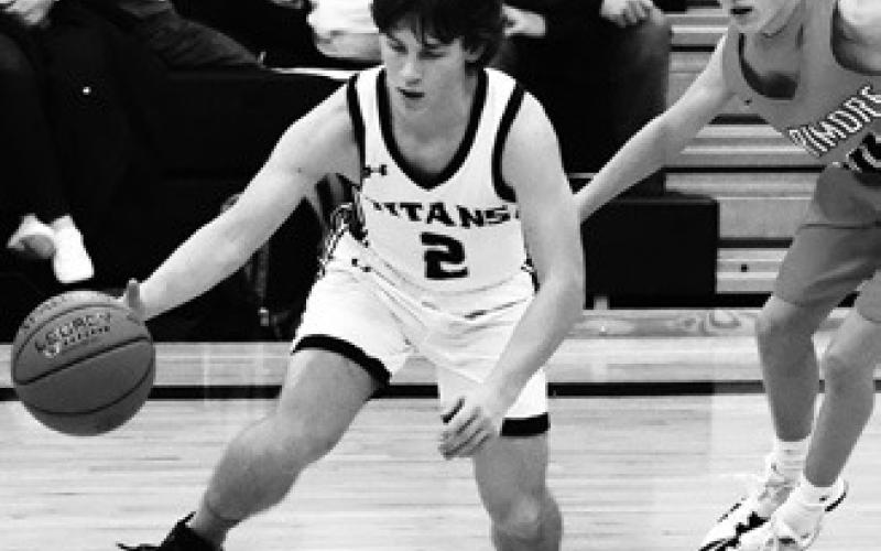 Logan Wieler works past a Larimore defender. Photo by Lyle Van Camp.