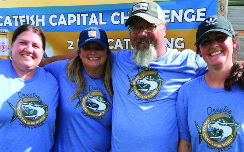 Mary Casmey, Nicole Weber, Brad Durick, and Shannon Hartwig came down from Grand Forks to assist with the tournament by weighing fish and organizing numbers. Not photographed, Madi Estad. Photo by Rob Boll.
