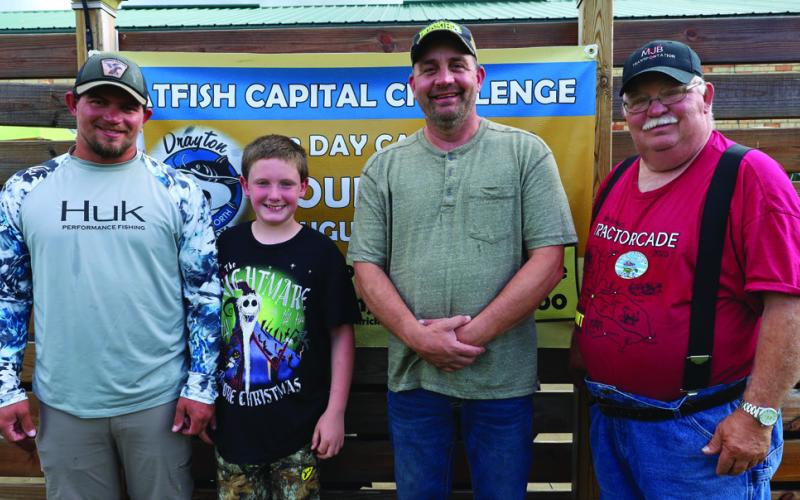 A first for the tournament - these two teams had four generations fishing in two boats last weekend. The Bachs come to the tournament from Iowa every year. (L-R) Dakota, Marcus, August, and Byron Bach. Photo by Rob Boll.