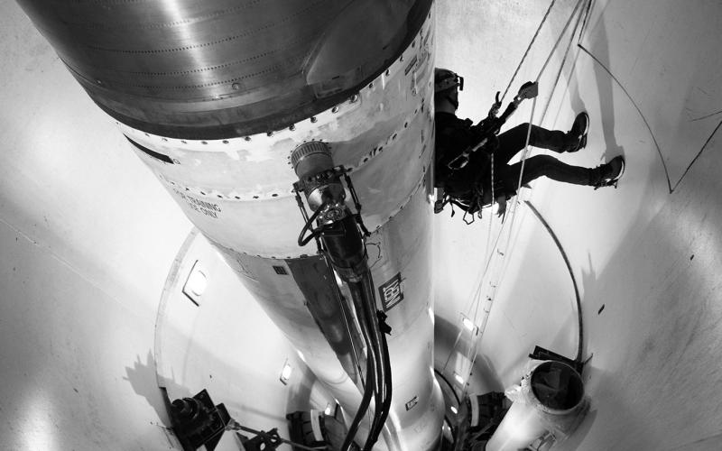 An Air Force firefighter repels down a training missile silo during a training exercise at F.E. Warren Air Force Base in Wyoming on Oct. 26, 2024. Photo by Hunter C. Kirkland/U.S. Air Force