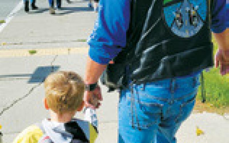Paul Larocque walking with his grandson at the TEARS walk. Photo by Stormylynn Manley.