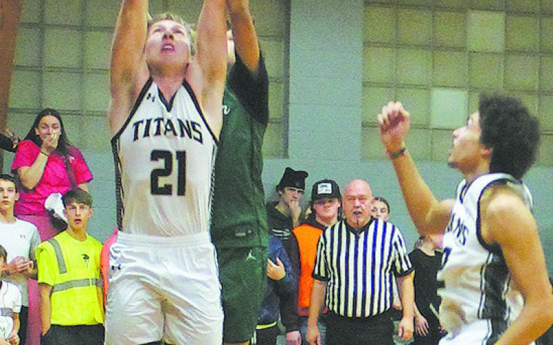 DVE's Carter Oberg comes down with the rebound. Photo by Jamie Rarick.
