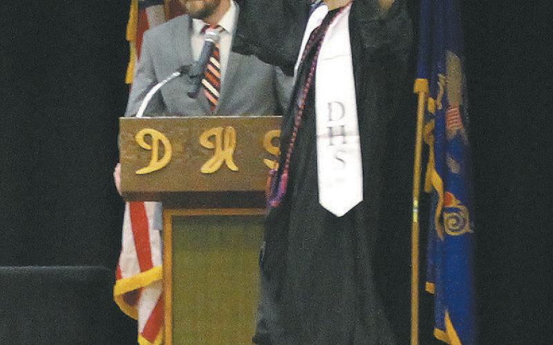 Senior Trypp Castillo doing a happy dance on his way to receive his diploma. Photo by Andrea Johnston