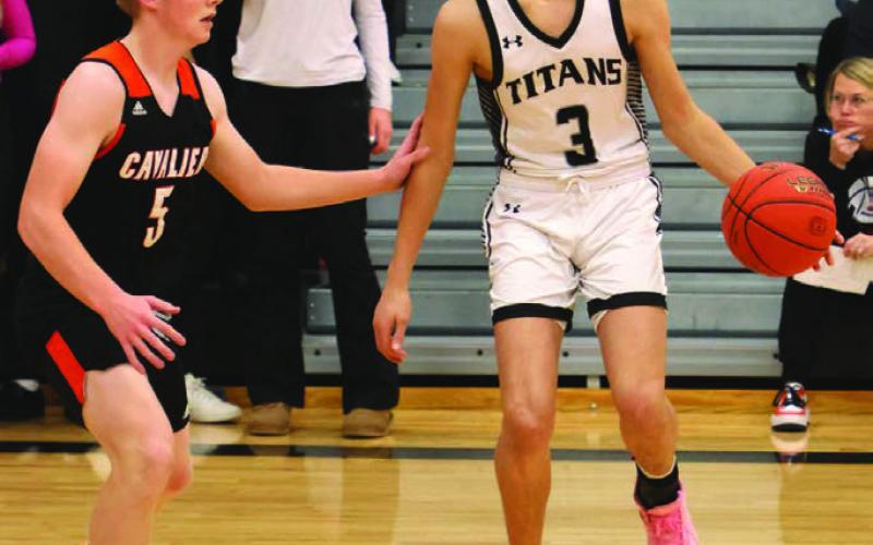 Calvin Otto tries to work past Cavalier’s Zack Anderson