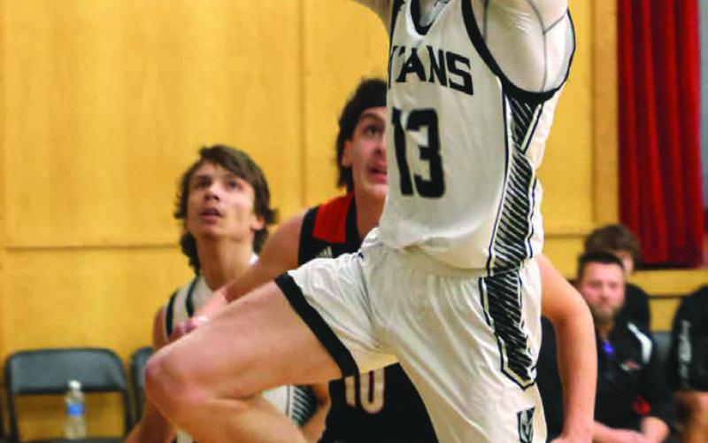 Connor Hurtt shoots past the Cavalier defense.