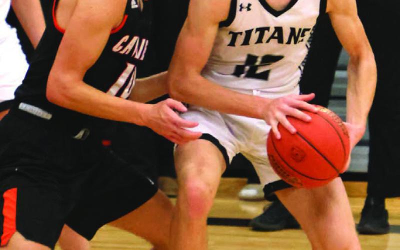 Everett Fedje looks for an open team mate in action against Cavalier.