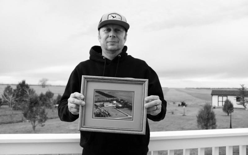 Farmer Tyler Stafslien stands in front of storage silos holding grain and soybeans in Ryder, North Dakota on Nov. 14, 2025. The tariff war with China forced Stafslien to store more of his soybeans this harvest season. Photo: Gabrielle Nelson/Buffalo’s Fire