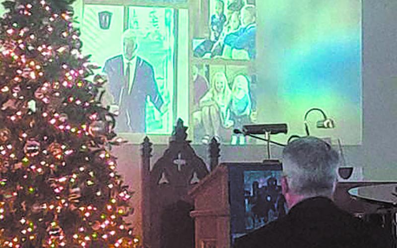 A video slide show was presented in honor of Dryburgh. Images and music were selected by Kris Heine and they were assembled by Tracy Giles. Photo by Christine Jensen