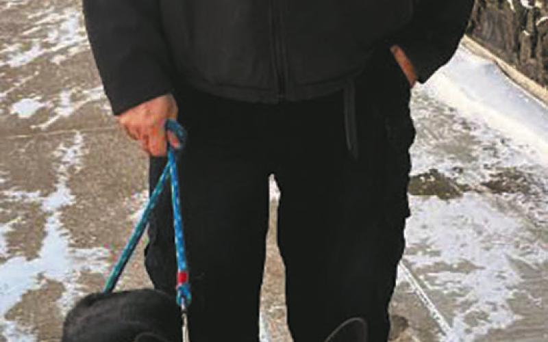 Freeway the “community dog” and his dad Officer Mattice. Photo by Christine Jensen