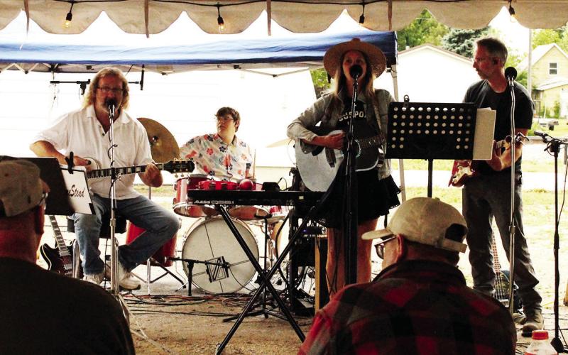The Homestead Band provided live music outside the curling club on Friday. Photo by Jamie Rarick