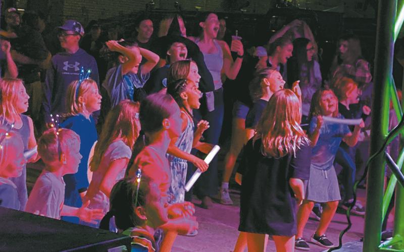 Kissing Company (and the audience) belts out Pink Pony Club, one of the more popular songs of the evening. Photo by Rob Boll