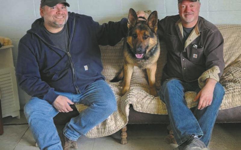 Jeremy Praska (left) and Greg Andreen (right) pose with Freeway at The Animal Elskan Inn last Friday.
