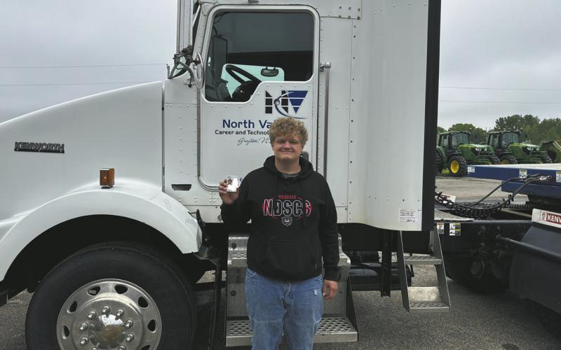 Bryce with his newly awarded license. Photo courtesy of North Valley in Grafton.