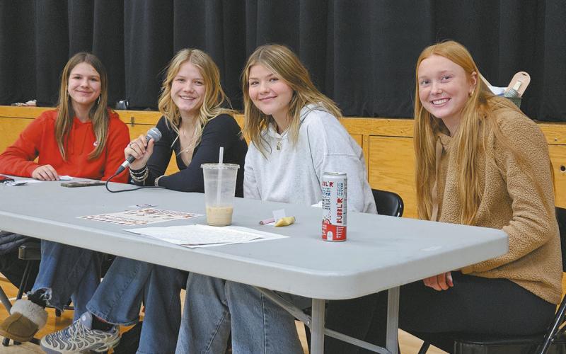 Prom committee members Violet Hoyles, Alyssa Hoyles, Alyvia Quibell, and Peyton Larson assisted with calling numbers during turkey bingo on Sunday evening. Photo by Jamie Rarick.