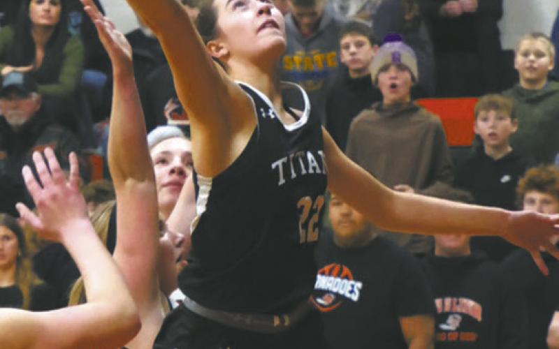 Titan senior Jaelyn Johnson extends for the basket during play against Cavalier Jan 5. Photo by Jamie Rarick