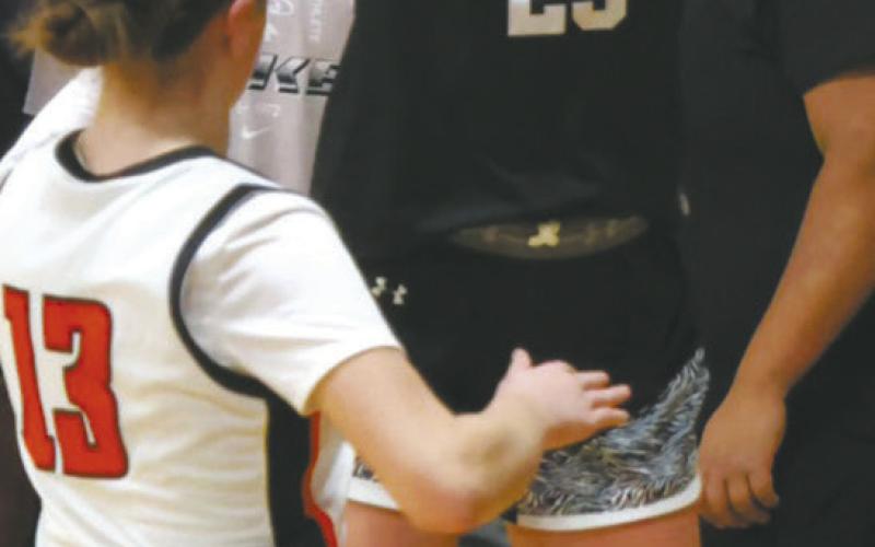DVE's Peyton Larson gets the shot off over Cavalier defender Shirley Kemp. Photo by Jamie Rarick