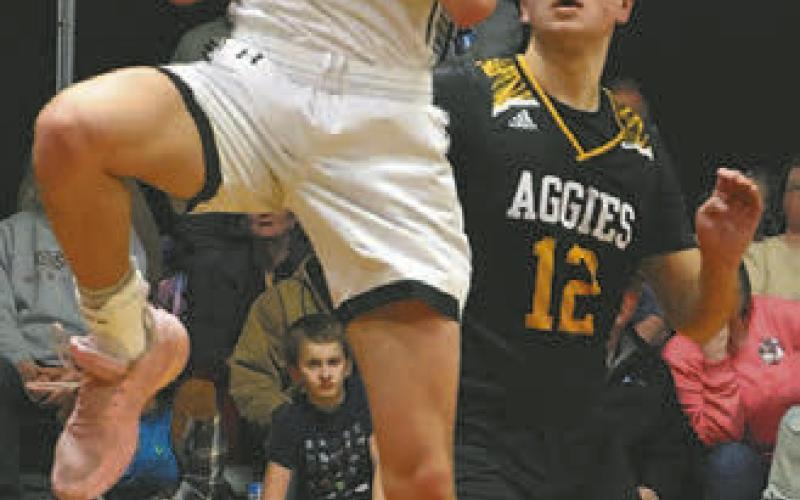 Everett Fedje pulls down a rebound against Park River last Tuesday.