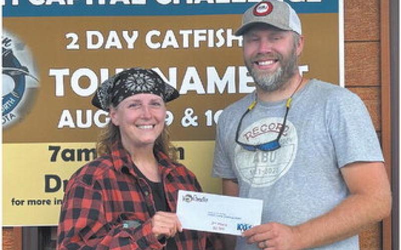 Second place winners May Thompson of East Grand Forks (left) and Jayson Ackerson, West Fargo. Photo by Andrea Johnston