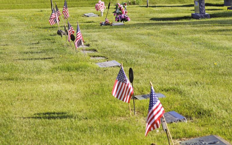 Flags decorating the gravesites of Veterans buried in the Drayton Cemetery for Memorial Day. VNV Photo by Lesa Van Camp