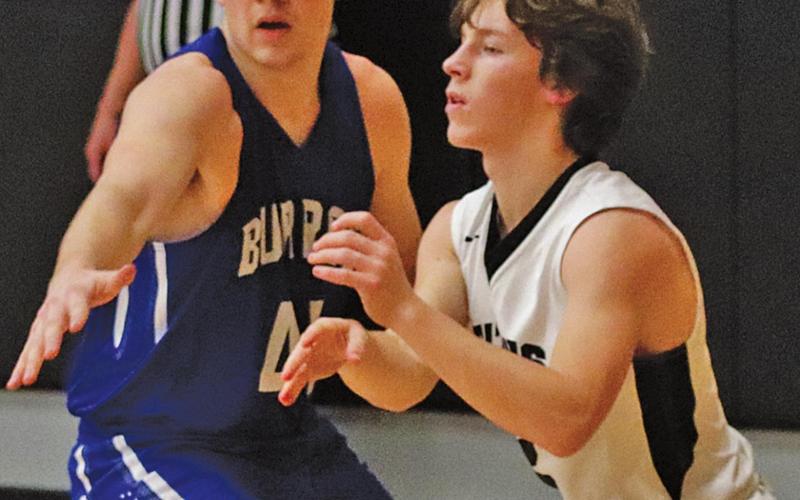 Logan Wieler is guarded by Burro Caden Waterworth last Friday night. VNV photo by Lesa Van Camp
